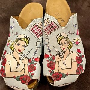 Calceo nurse motif cork slides; leather